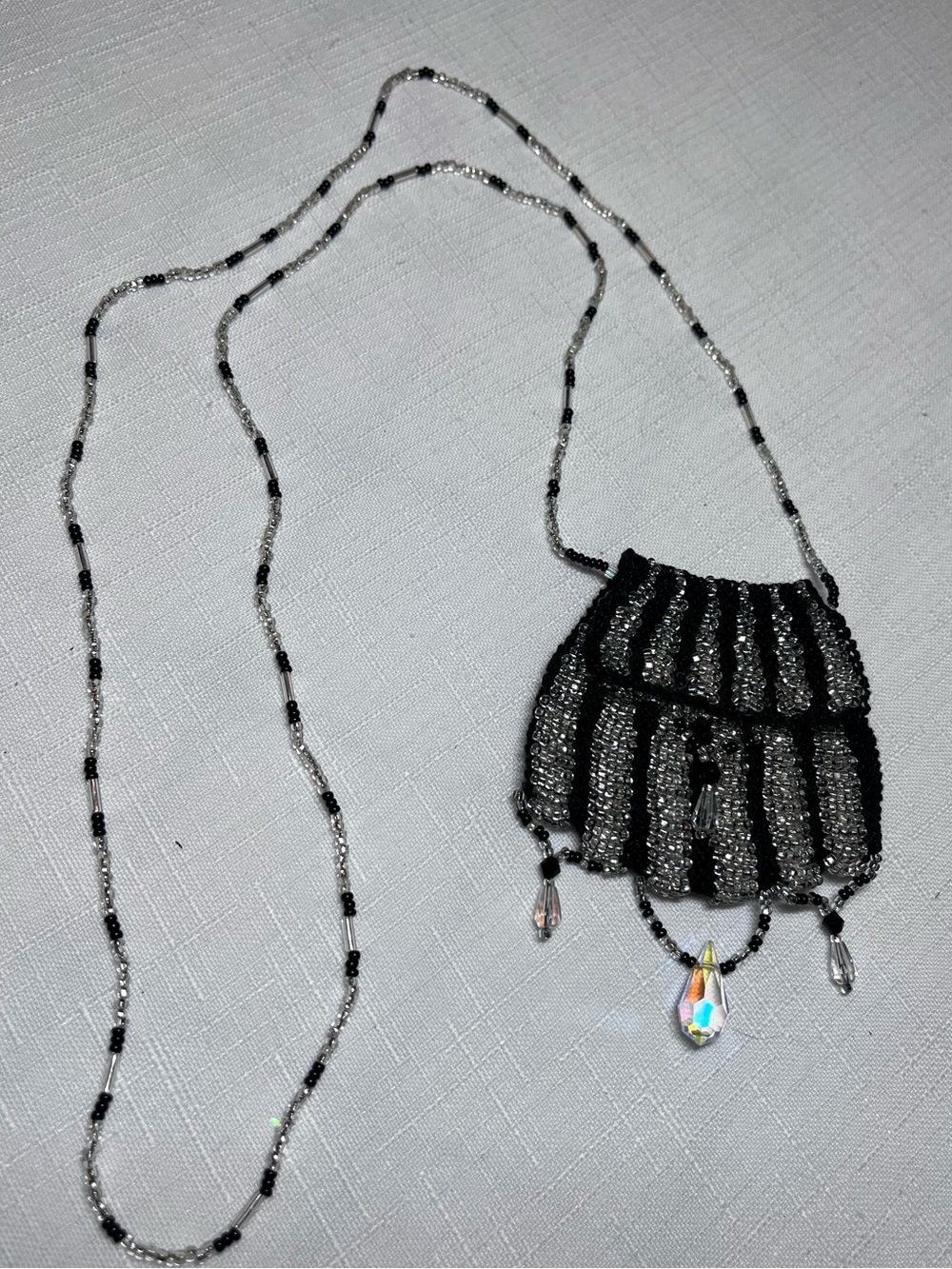 Charming miniature crocheted seed-bead pouch necklace